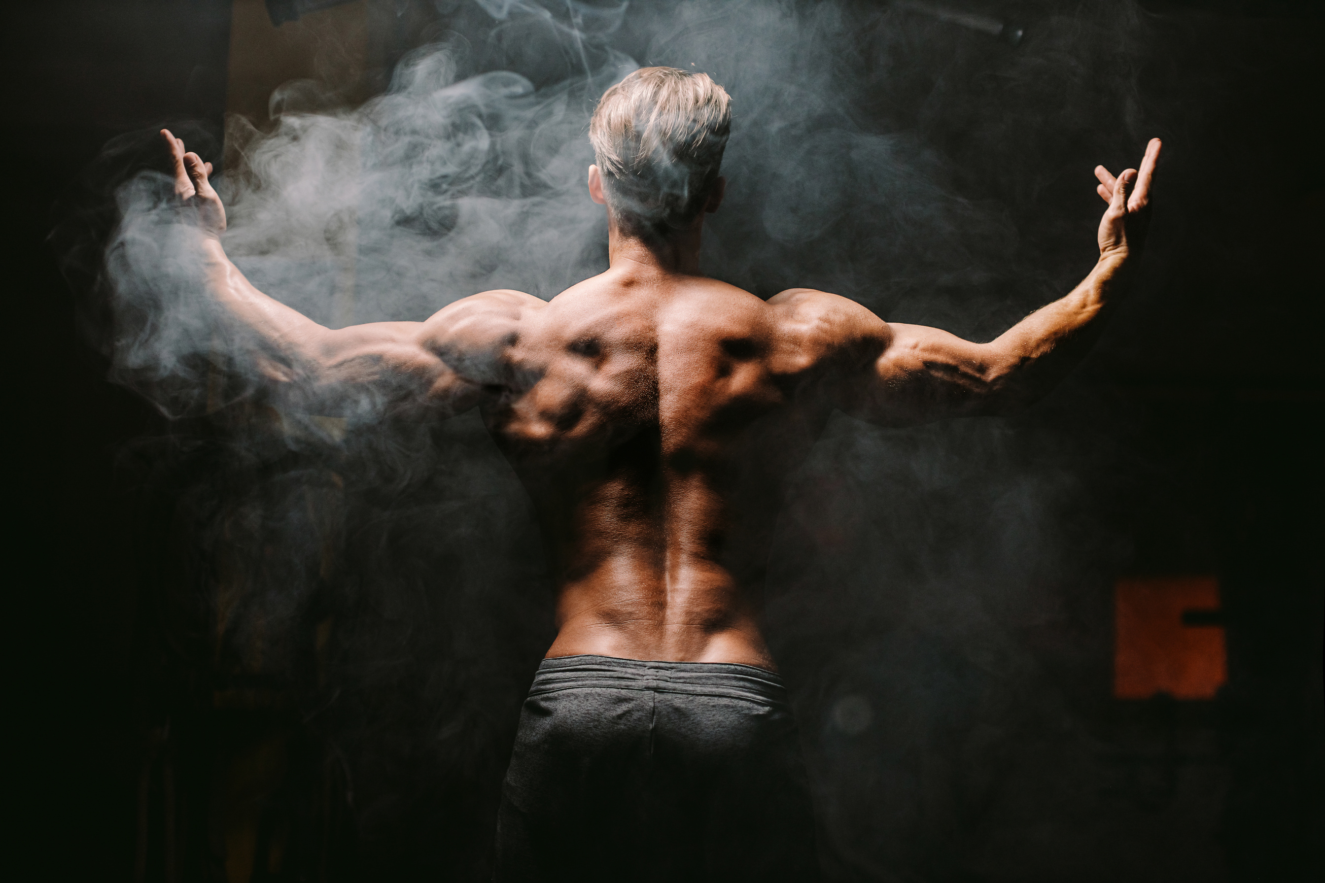 Muscular Man Posing at the Gym