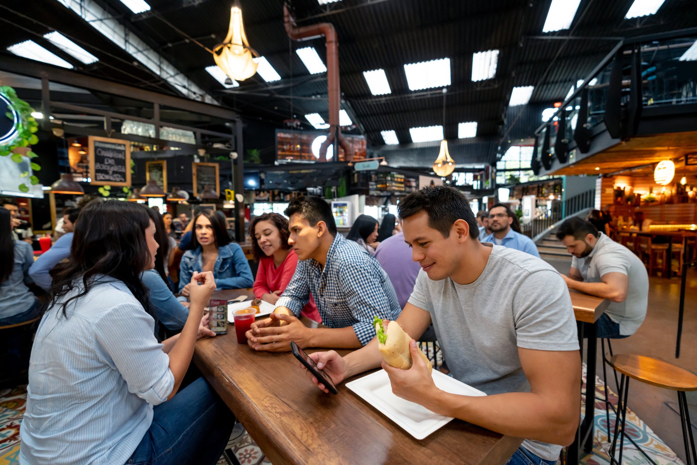 Group of people eating lunch at the food court