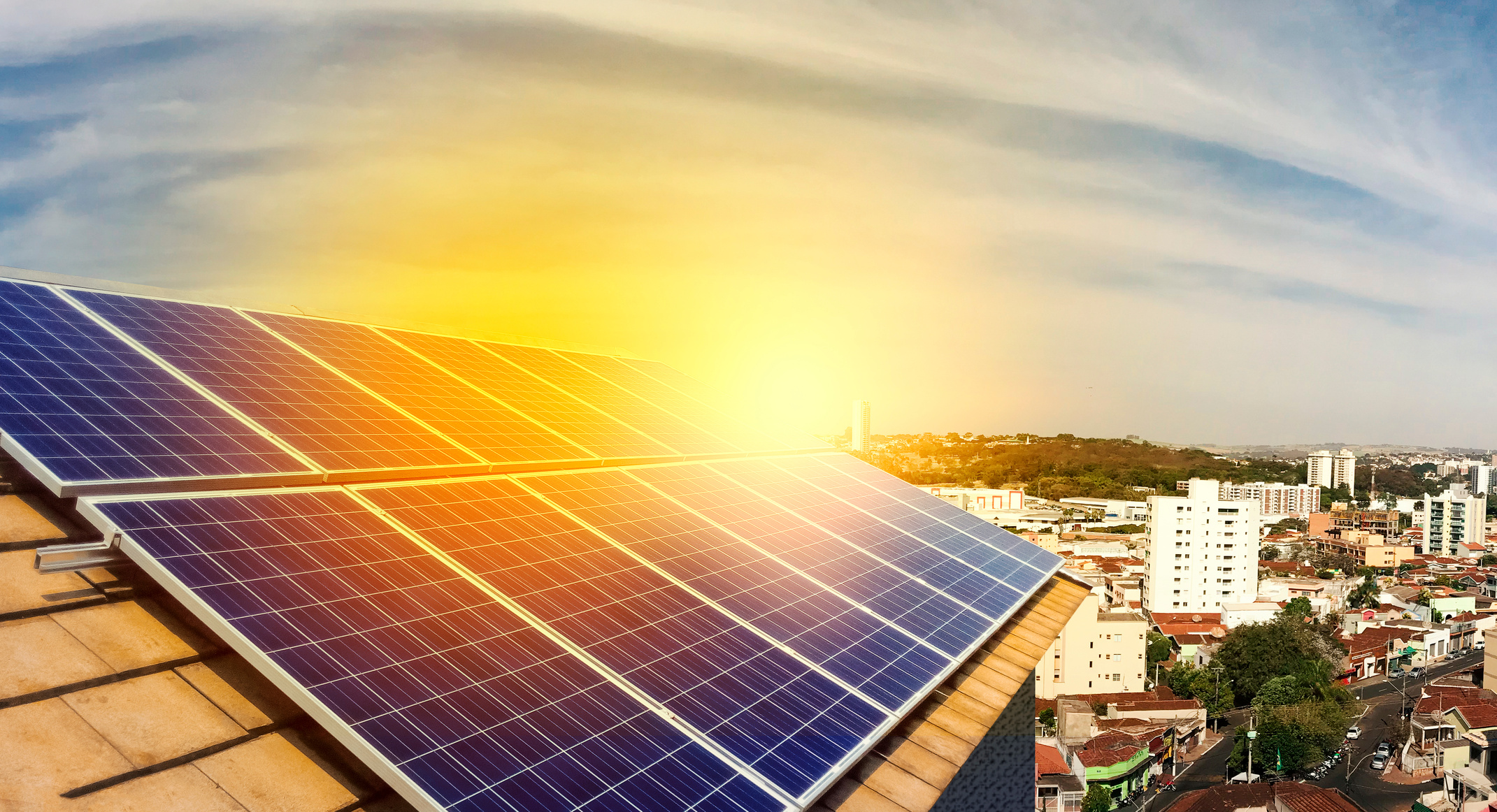 Photovoltaic power plant installation on the roof of a residential building on sunny day - Solar Energy concept image.