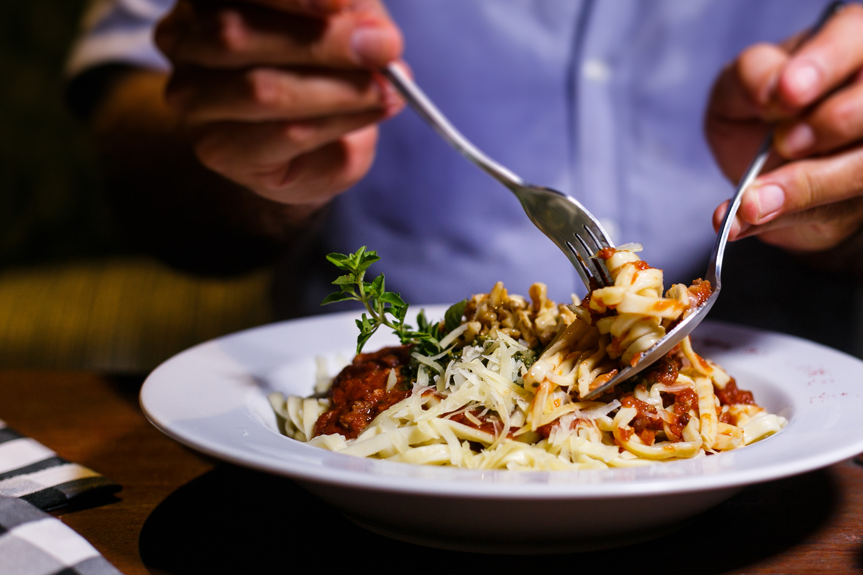 Close Up Shot of a Person Eating Pasta